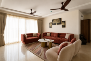 Custom luxury living room interiors by Comfort Point with bespoke sofas, accent chairs, designer curtains, marble coffee tables, and premium home furnishings in Chennai