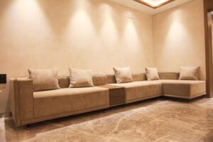 Luxury living room featuring a custom sofa, accent chair, designer curtains, and modern home furnishings by Comfort Point.